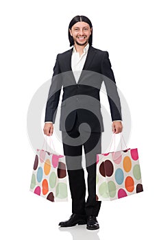 The black suit man holding plastic bags isolated on white