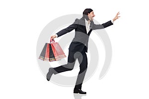 The black suit man holding plastic bags isolated on white