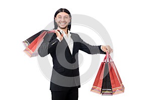 Black suit man holding plastic bags isolated on white