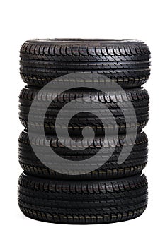 Black summer tires isolated on white