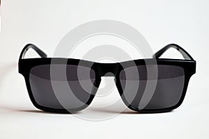 Black sunglasses, black frame isolated on a white background photo