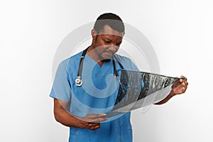 Black surgeon doctor bearded man in blue coat with crossed arms isolated white background copy space