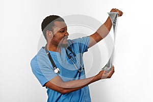 Black surgeon doctor bearded man in blue coat with crossed arms  white background copy space