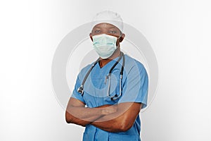 Black surgeon doctor man in blue coat white cap and surgeon mask isolated on white background