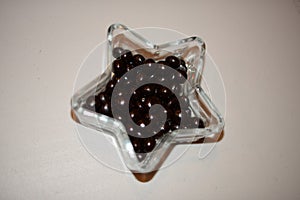 Black and sweet chocolate drop on crystal bowl