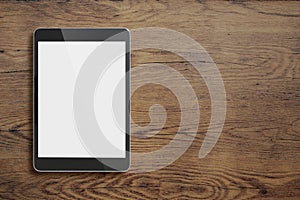 Black tablet pc on old wood table background