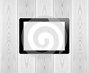 Black tablet pc same with ipade on wood background