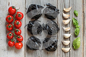 Black Tagliatelle pasta with cherry tomatoes, garlic and basil