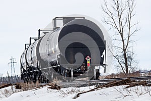 Black Tank Cars Curving Around a Corner