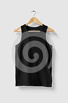 Black Tank Top Shirt mockup on wooden hanger isolated on light grey background front side view.