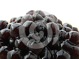 Black tapioca ball also known as boba in bubble tea. ingredients for making pearl milk tea.