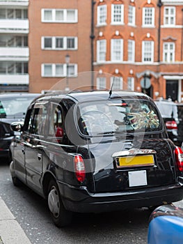 Black Taxi in London Road without people, England