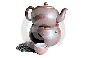 black tea and clay teapot white background