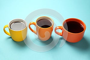 Black tea coffee in bright cups, office break, team building