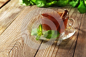 Black tea in a glass cup and saucer