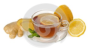 Black tea in glass Cup with saucer and healthy ginger root, mint and lemon isolated on white background