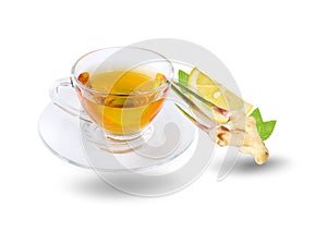 Black tea in glass Cup with saucer and healthy ginger root, mint and lemon an isolated on white background