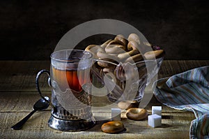 Black tea in glass with cupholder and drying