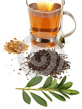 Black Tea with Leaf and brown Sugar isolated on white Background