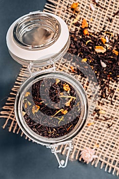 Black tea with natural additives in a glass jar