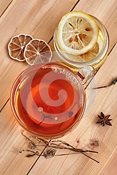 Black tea with slice of lemon in glass cup