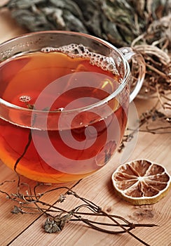Black tea with slice of lemon in glass cup