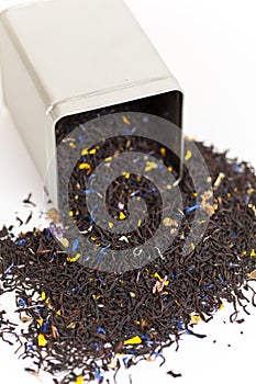 Black tea spilling out of a tea box