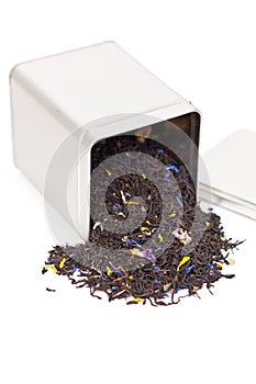 Black tea spilling out of a tea box