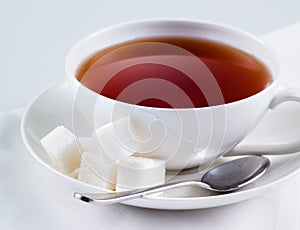 Black tea with sugar cubes