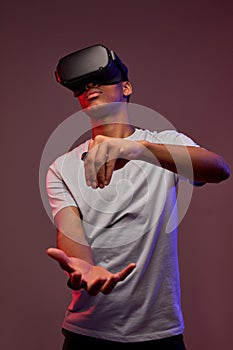 black teen boy wearing virtual reality goggles or playing video games, isolated