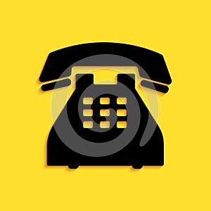 Black Telephone icon isolated on yellow background. Landline phone. Long shadow style. Vector