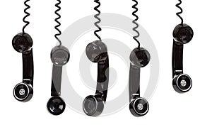 A black telephone receiver on a white background