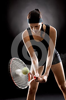 Black tennis woman hit ball with racket