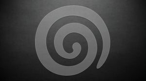 A black textured background with a subtle gradient effect