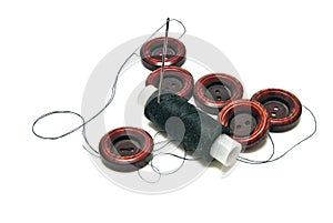 Black thread and buttons on white