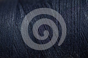 Black thread spool background