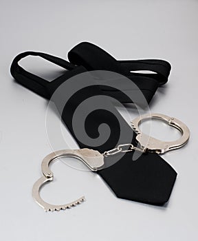 Black tie and handcuffs
