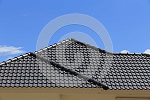 Black tiles roof on a new house