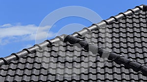 Black tiles roof on a new house