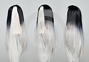 Black top straight long hair white bottom part wig on mannequin head over gray background isolated