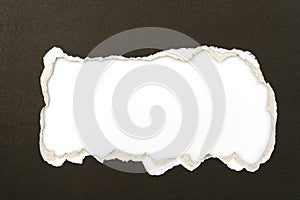 Black torn paper isolated on white background