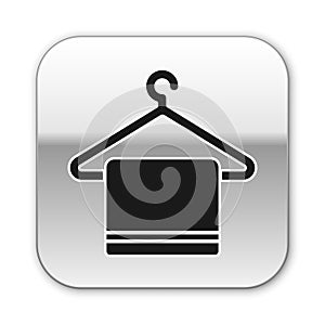 Black Towel on a hanger icon isolated on white background. Bathroom towel icon. Silver square button. Vector