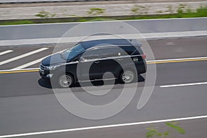 Black Toyota Innova Driving fast on trans jawa highway