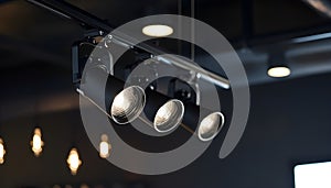 Black track lighting with five spotlights.