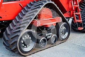 A close up of modern rubber tractor tracks