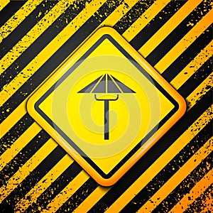 Black Traditional Japanese umbrella from the sun icon isolated on yellow background. Warning sign. Vector