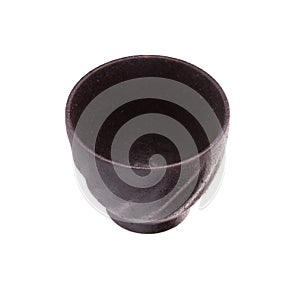 Black traditional tea cup of cast iron isolated on white background