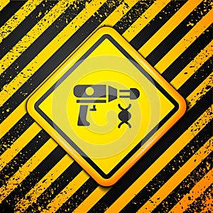 Black Transfer liquid gun in biological laborator icon isolated on yellow background. Warning sign. Vector