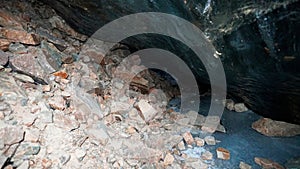 The black transparent color of ice in the cave.