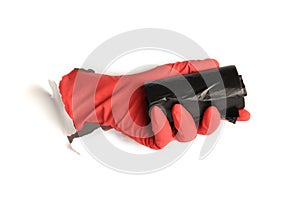 Black trash bag in hand in protective glove on white background